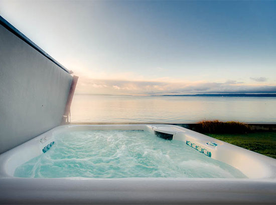 Soak in this top quality hot tub and enjoy beautiful views at the water’s edge.