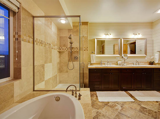 This spacious bathroom is a private oasis for the lucky occupants of the master bedroom. The beautiful neutral colored granite/travertine tile is restful and creates the feeling of a luxurious day spa. Includes Egyptian cotton towels.